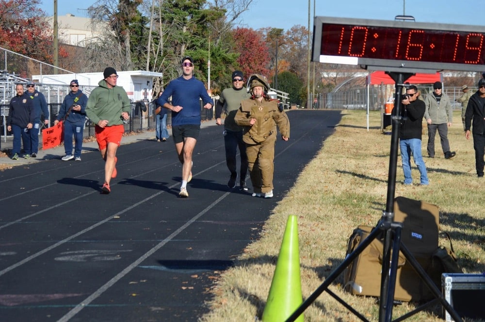 1LT Faust from the 52nd EOD sets a new world record run in a bomb suit with a time of 10 minutes, 19 seconds, at Fort Belvoir's Pullen Field, Nov. 14. She surpassed the last record by four seconds.